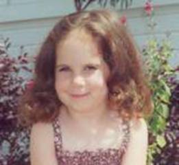A young child wearing a bib

Description automatically generated