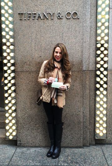 A person standing in front of a wall with lights

Description automatically generated
