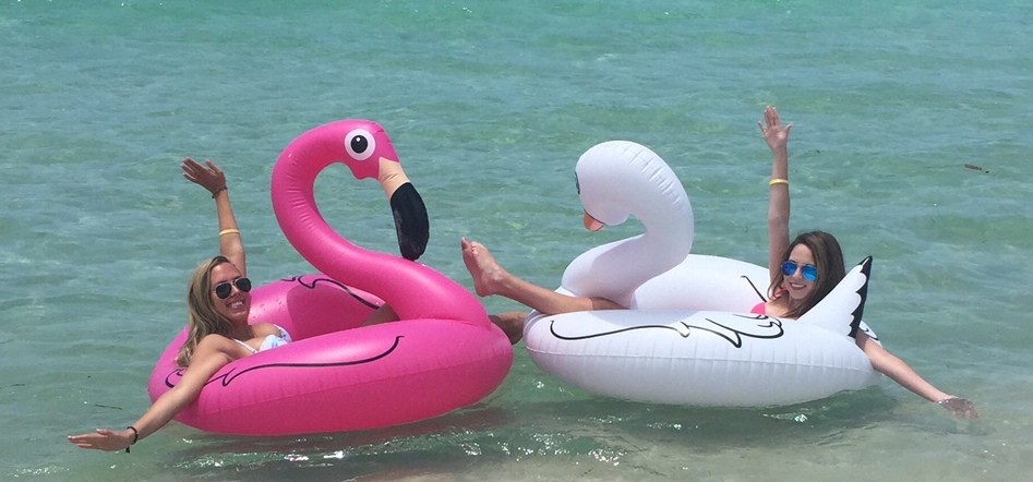 Two people floating in a pool float

Description automatically generated
