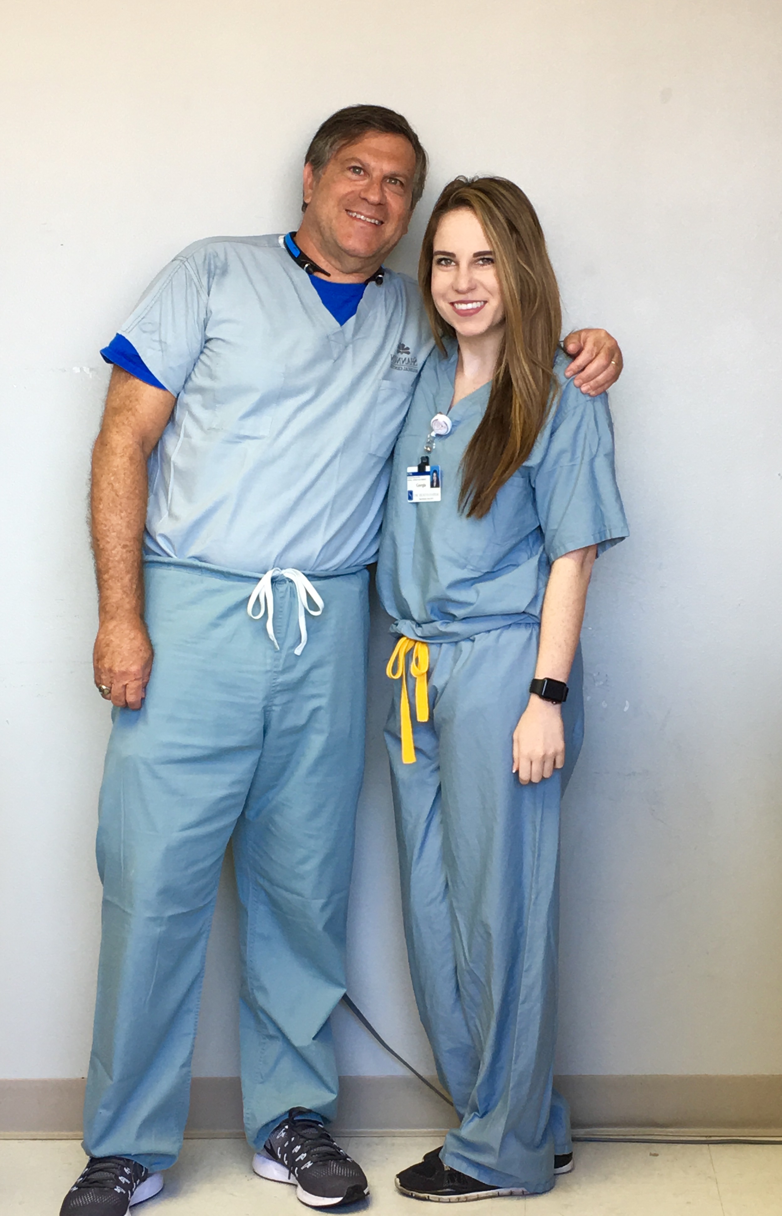 A person and person wearing scrubs

Description automatically generated