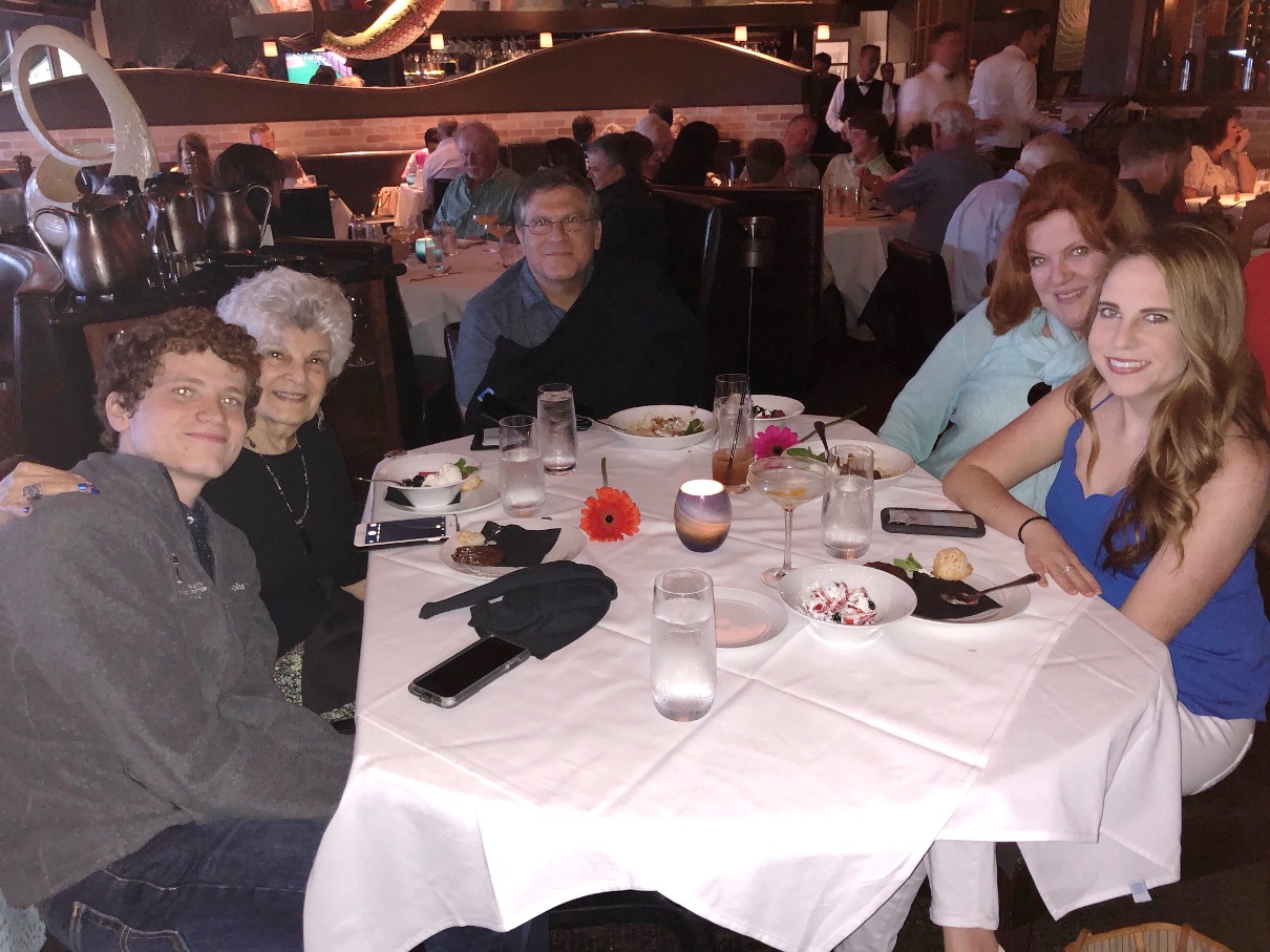 A group of people sitting at a table

Description automatically generated