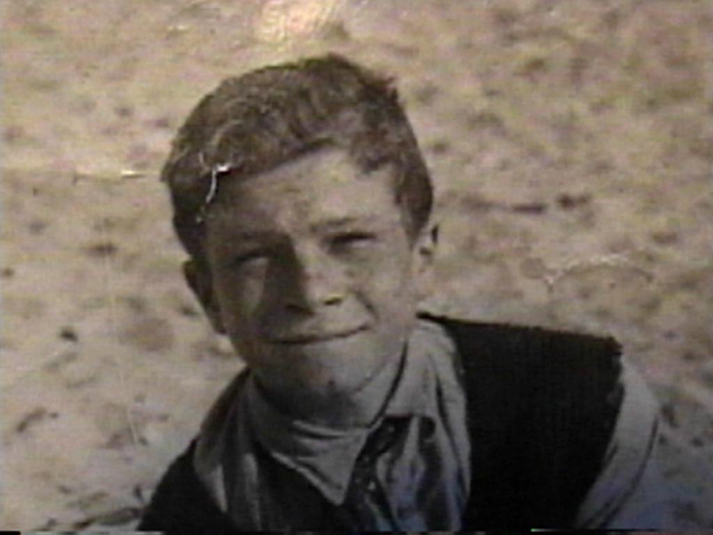 A child smiling for the camera
Description automatically generated
