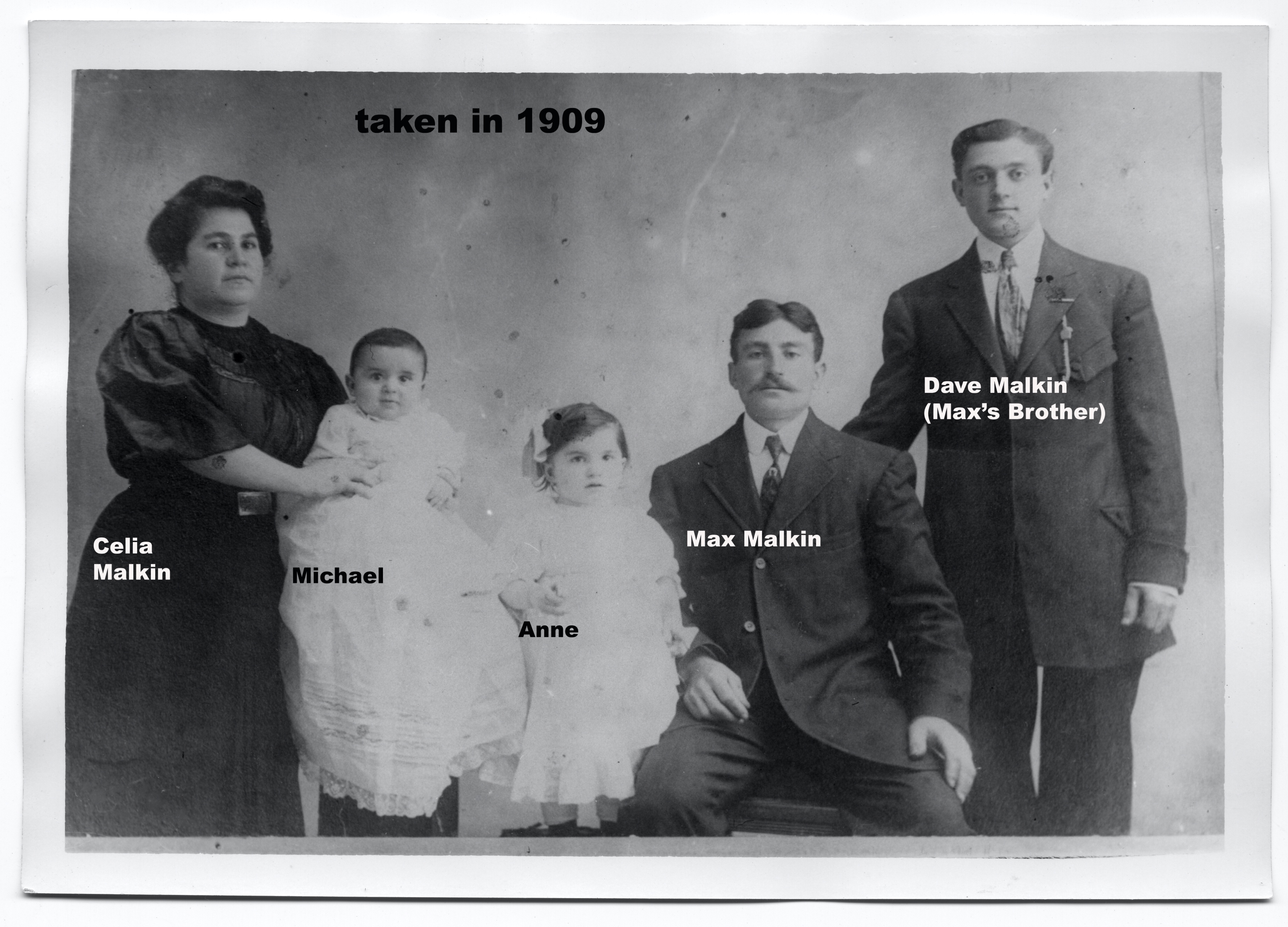 A group of people posing for a photo

Description automatically generated