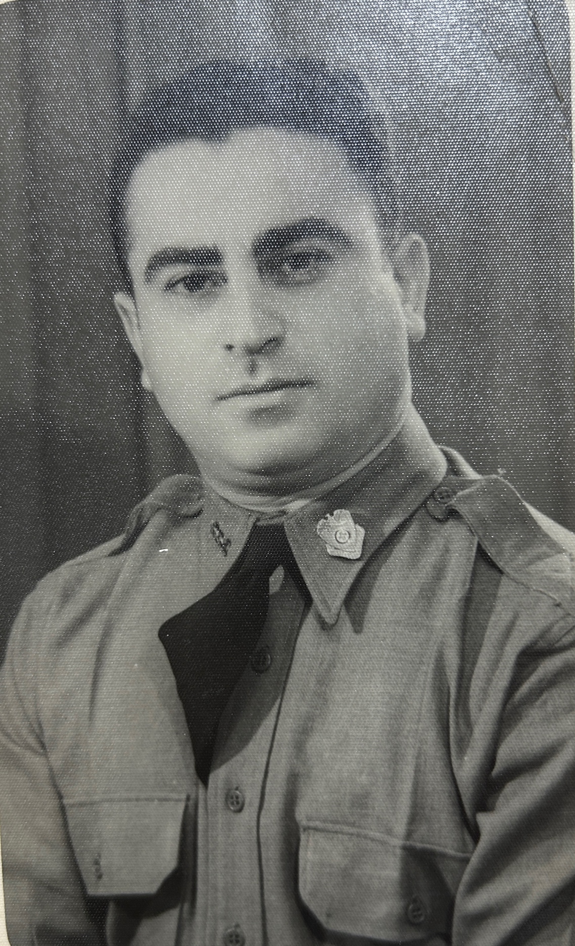 A person in a uniform
Description automatically generated