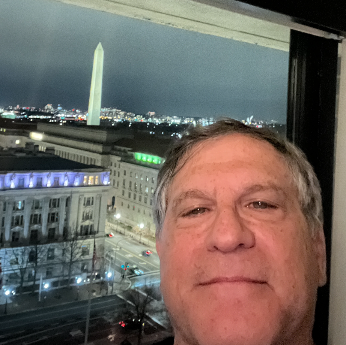 A person taking a selfie

Description automatically generated