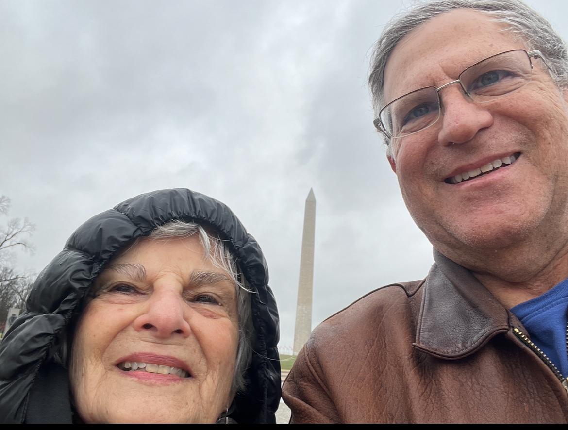 A person and person taking a selfie

Description automatically generated